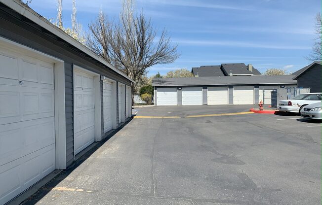 a parking lot in front of a garage