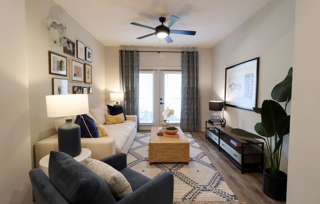 The Crest at South Point Apartments 1 Bedroom Model Living Space located in McDonough, GA