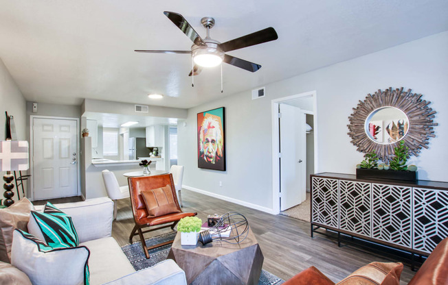a living room with a ceiling fan and hardwood floorsat The Julia, Mesa, 85210