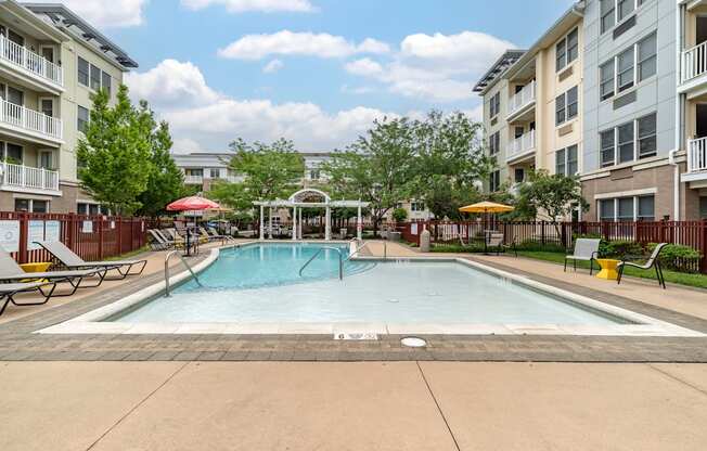 our apartments feature a swimming pool and a patio with umbrellas at Pier Village Apartments, Long Branch, New Jersey