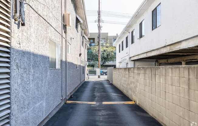 A narrow alley with a yellow line down the middle.