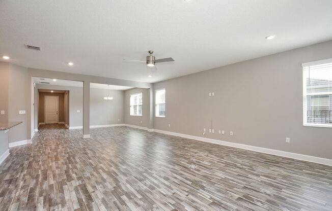 Gorgeous 4/3 Spacious Home with a 2 Car Garage Located on a Conservation Lot in Creekstone Neighborhood – Orlando!