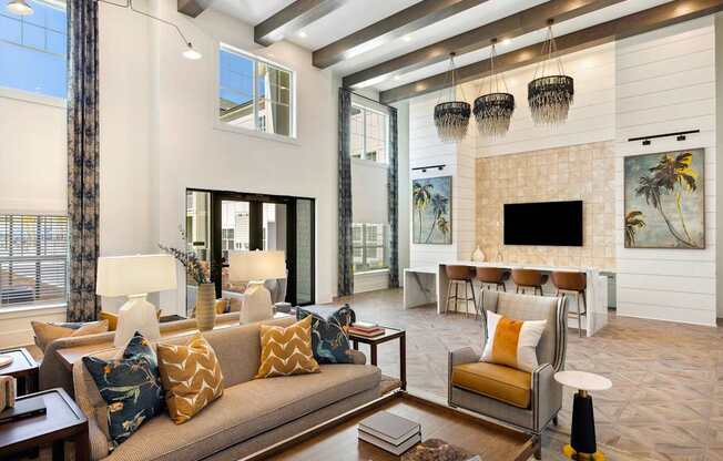 A living room with a couch, chairs, and a fireplace.