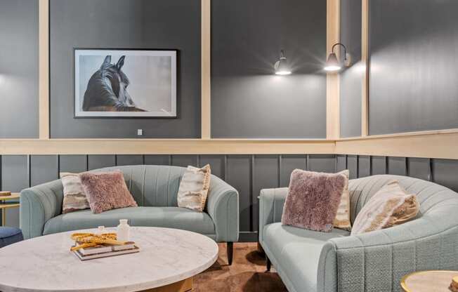 a living room with two couches and a coffee table at The Lodge at Overland, Rochester, MN