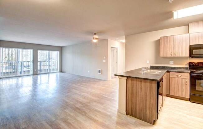 A kitchen with wooden cabinets and a countertop is shown.