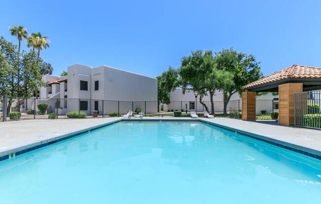 a large swimming pool with a building in the background at Tides at Mesa, Mesa, AZ, 85204