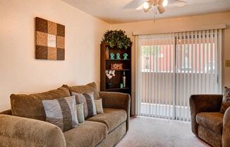 Living Rooms With Decorative Blinds at Desert Creek, Albuquerque, NM 87107