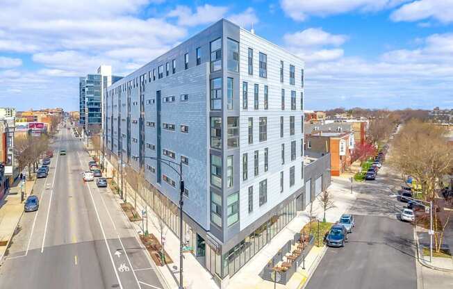 a large blue building on the corner of a city street