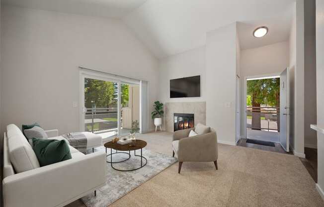 a living room with a couch and a chair and a fireplace at Rush River Apartments, California, 95831