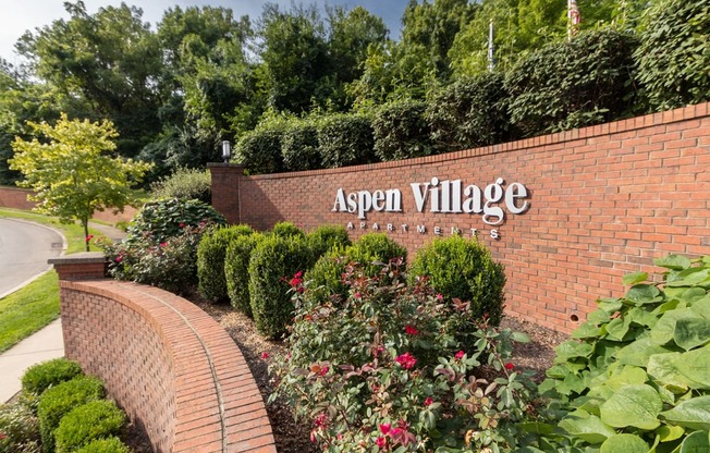 This is a photo of the entrance sign at Aspen Village Apartments in Cincinnati, OH.