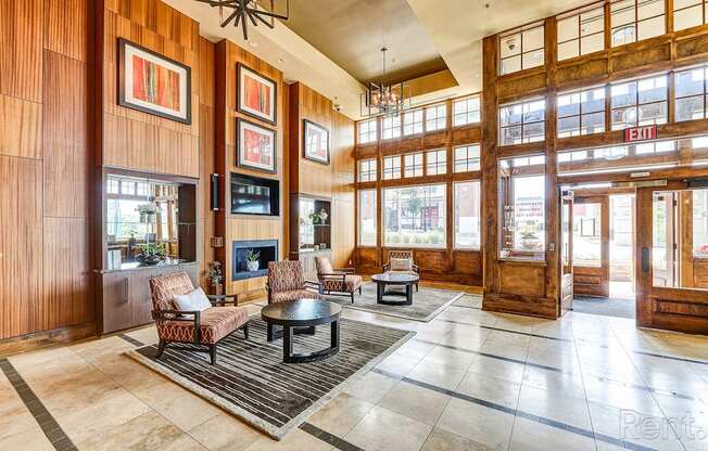 A living room with a fireplace and a TV.