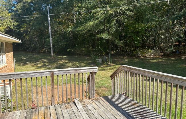 Welcome home! Private location, large wooded LOT, 2 living rooms, fireplace, large deck, kitchen w/island, must see!