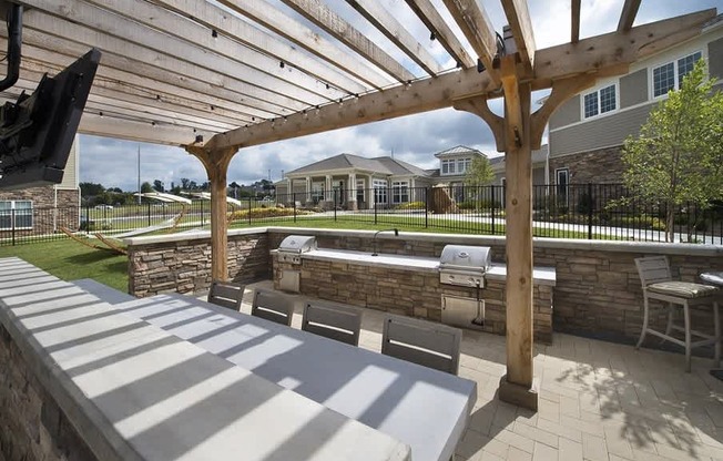 Outdoor living space with gas grills and fire pit
