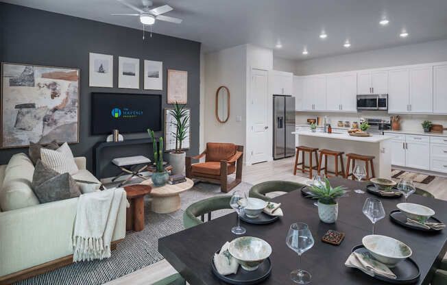 A modern dining room with a black table set for six.