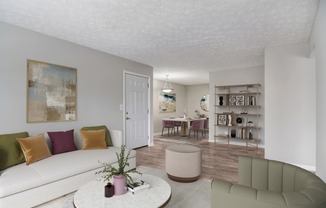 a living room and dining room with a white couch and a table