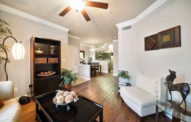 A living room with a black coffee table and a white couch.