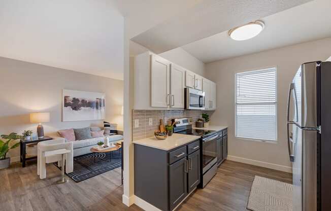 our apartments at the district feature a spacious kitchen and living room at Paisley and Pointe Apartments, Las Vegas, Nevada