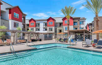 our apartments have a swimming pool with a lot of chairs and umbrellasat Weylyn Luxury Apartments, Arizona