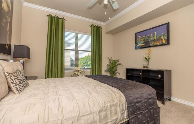 a bedroom with a large bed in a hotel room