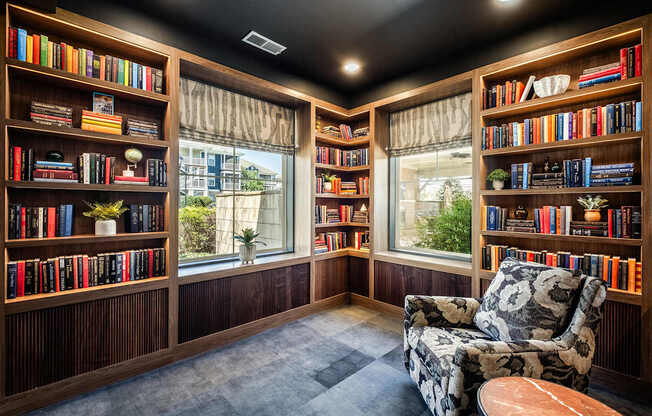 A room with a black ceiling and a chair with a floral pattern on it.