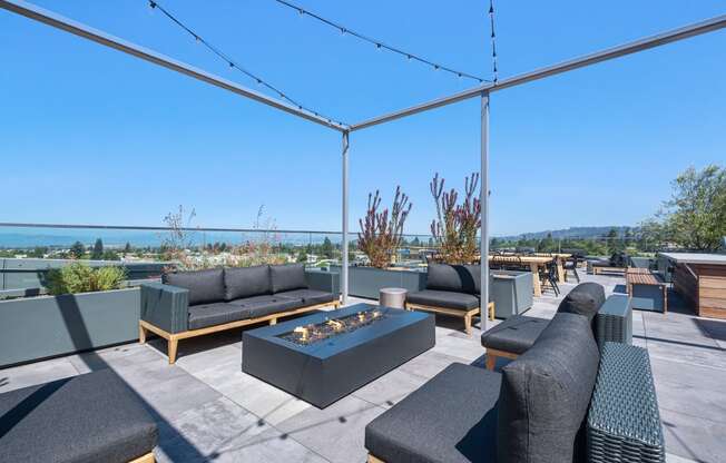 Dog-Friendly Apartments In Berkeley, CA - The Addison - Rooftop Patio With Outdoor Furniture, a Firepit, and Unobstructed Views of the City/Golden Gate Bridge