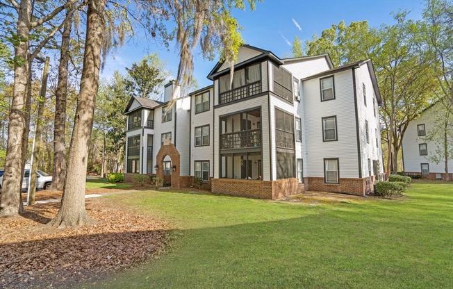 Residential building exterior with screened porches at Westbury Mews Apartments in Summerville SC 29485
