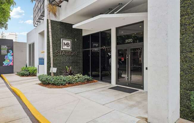 Welcoming entrance to MB Station apartments in Miami's Coral Way neighborhood with professional management and convenient access to nearby shopping, dining, and major employers.