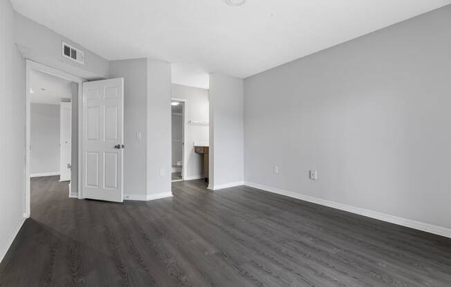 Open concept floor plans with large windows, vinyl wood flooring throughout, stainless steel kitchens, upgraded lighting with white and wood accents