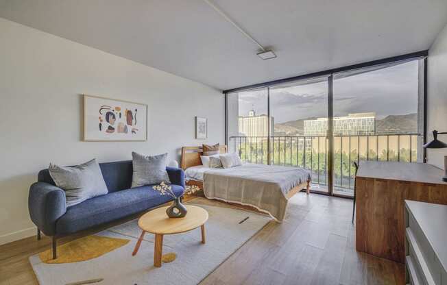 Studio unit with a living room and bedroom with hardwood flooring