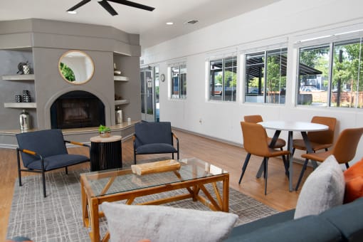 Leasing office seating area, fireplace, and windows