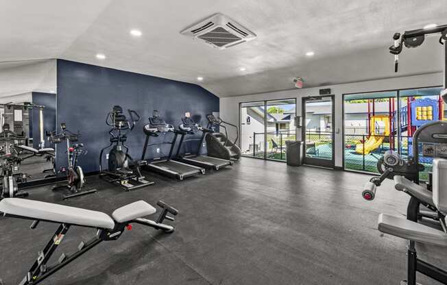 a gym with exercise equipment at Peaks at Live Oak in San Antonio, TX
