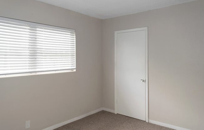 A bedroom with a window at Park Apartments