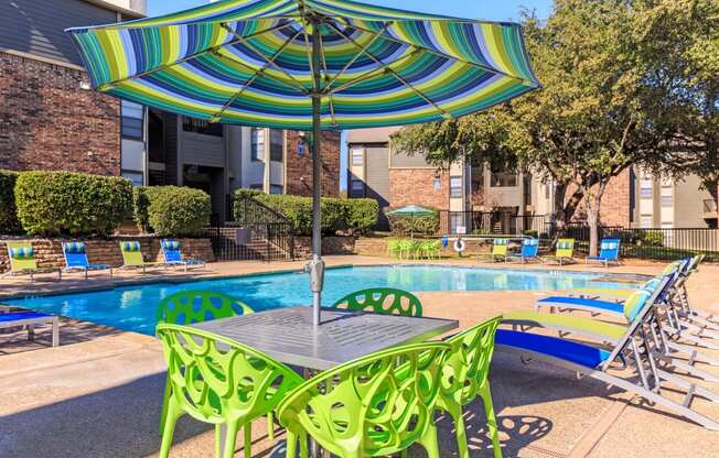 Outdoor table area  at The Summit Apartments in Mesquite, Texas, TX
