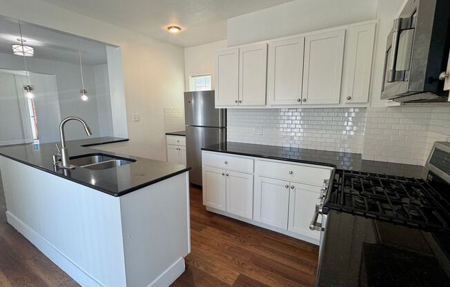 527 James SE- Water included. Huge deck. Main floor laundry. Modern kitchen.