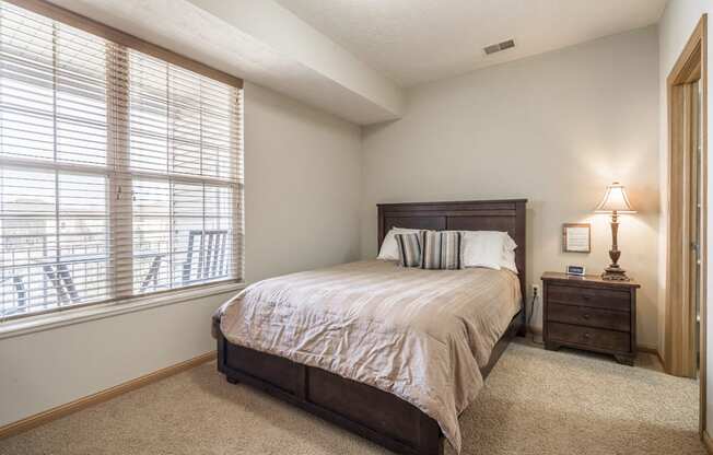 Interiors-Master bedroom in 1-bedroom townhome at Stone Ridge in South Lincoln NE