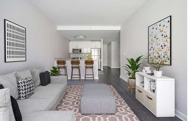 a living room with a gray couch and a rug at 34 Berry, Brooklyn, 11249