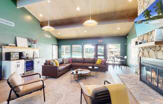 a living room filled with furniture and a fireplace