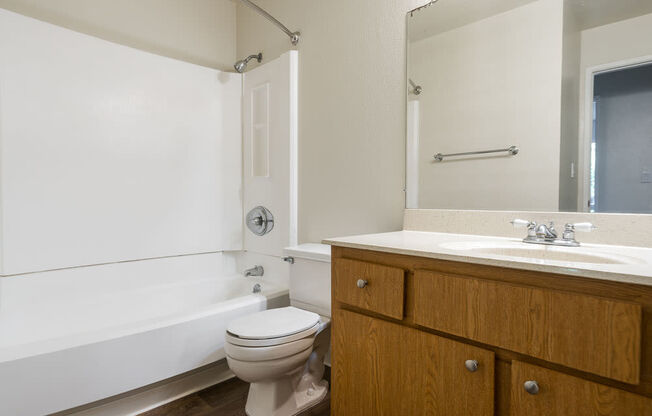 a bathroom with a sink toilet and a bath tub