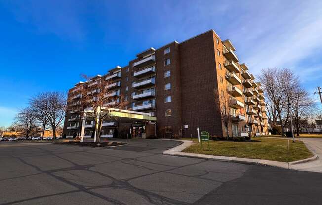 a large apartment building on the corner of a street