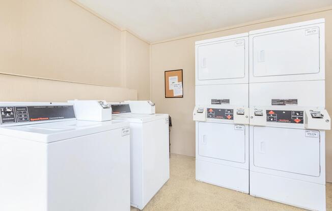 a white refrigerator freezer sitting inside of a kitchen