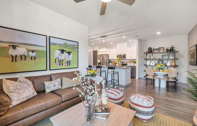 a living room with a couch and a tableat Weylyn Luxury Apartments, Arizona