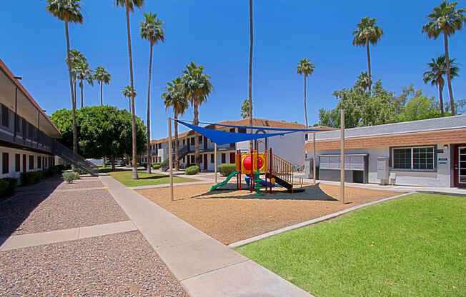 a playground at the enclave at woodbridge apartments in sugar land, tx