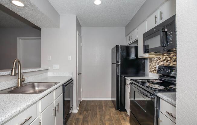 a modern kitchen with stainless steel appliances