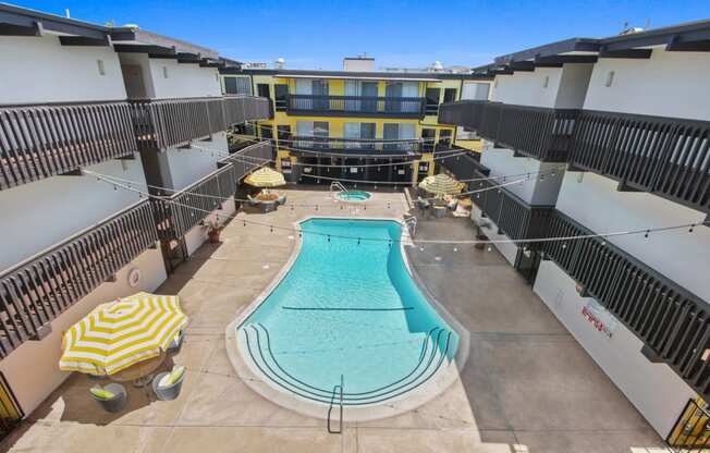 Resort-style swimming pool with lounge just steps from your front door