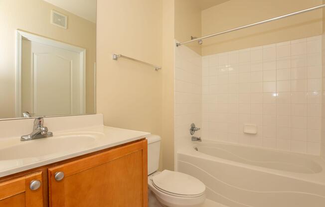 a room with a sink and a mirror