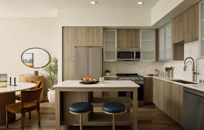A modern kitchen with a dining table and chairs.