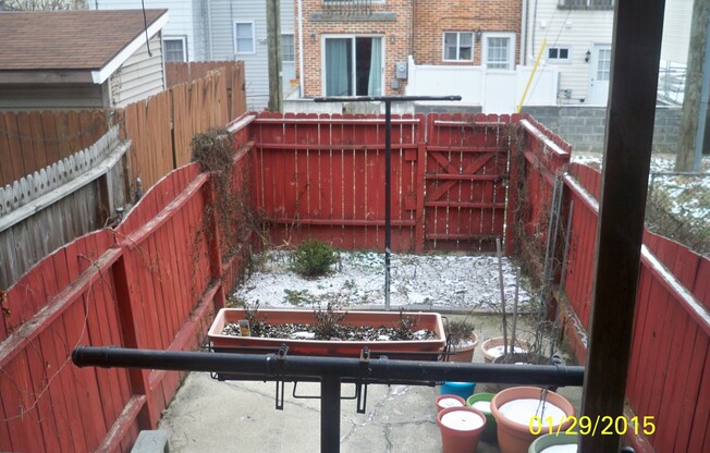 Charming Locust Point 2bd+Den/1ba Rowhome w/ W/D, CAC and One-Car garage! Available 7/15!