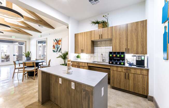 Kitchen with wooden cabinets and a white counter top at The Parker Austin, Pflugerville