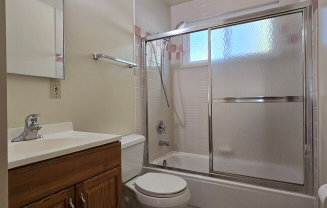 Renovated Home with New Kitchen, Stainless Steel Appliances, Wood Flooring, Fresh Paint, New Driveway, Great Location!