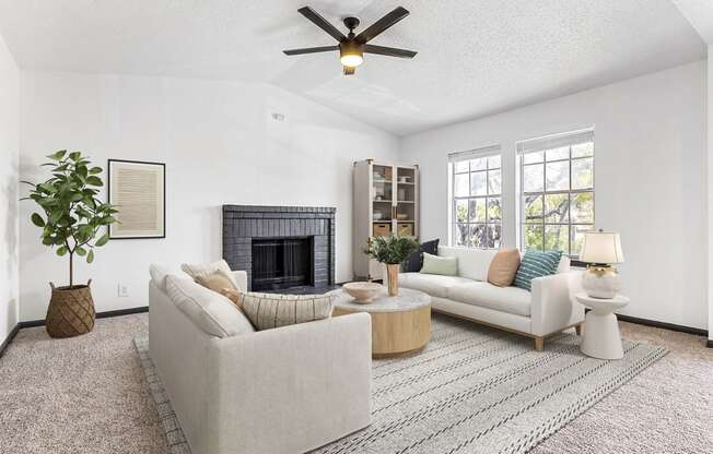 a living room with two couches and a fireplace